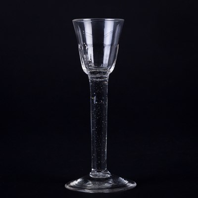 Lot 355 - A Georgian wine glass with fluted bowl on a...