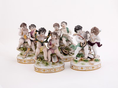 Lot 384 - A set of four German porcelain putti groups,...