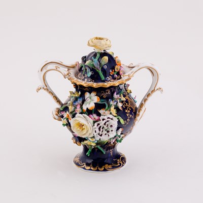 Lot 391 - An English flower-encrusted two-handled...