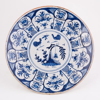 Lot 393 - A Dutch Delft blue and white dish, painted...