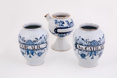 Lot 394 - Three English delft blue and white drug jars,...