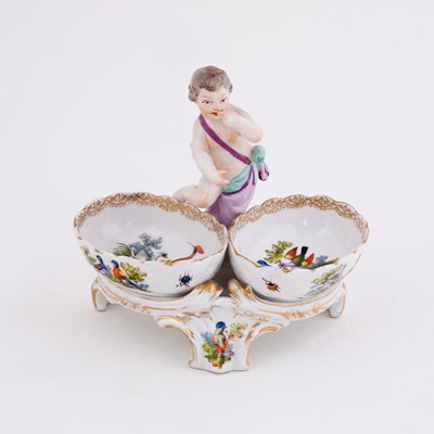 Lot 409 - A Continental porcelain figural salt, late...