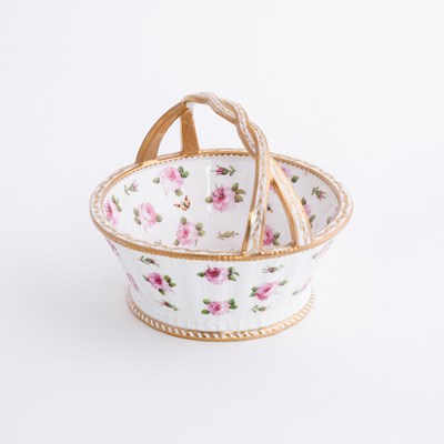 Lot 415 - A porcelain circular basket, painted with pink...