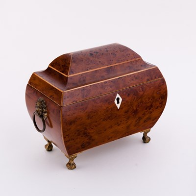 Lot 490 - A Regency yew wood sarcophagus shaped tea...