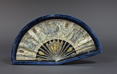 Lot 587 - An early 19th Century fan, the pierced shaped...