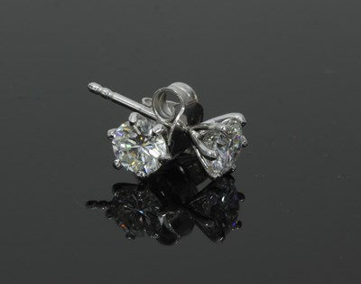 Lot 50 - A pair of diamond ear studs, claw set in 18ct...