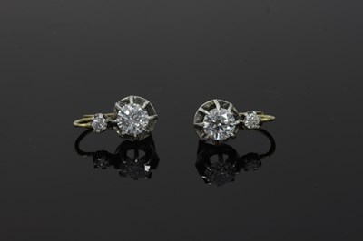 Lot 51 - A pair of diamond earrings, each with a...