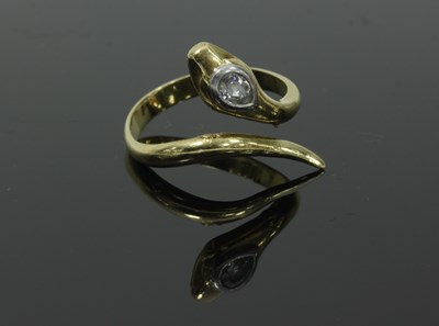 Lot 52 - A gold serpent ring, the head set with a pear...