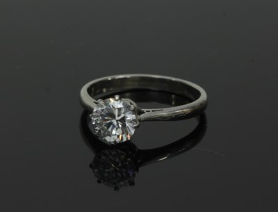 Lot 56 - A diamond solitaire ring, the claw set stone...