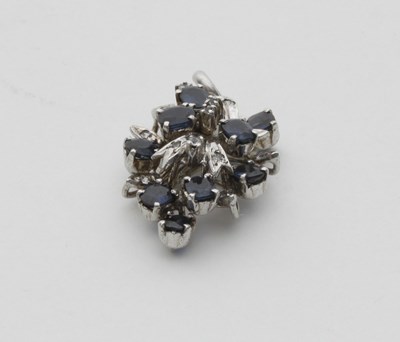 Lot 64 - A sapphire and diamond pendant, of openwork form