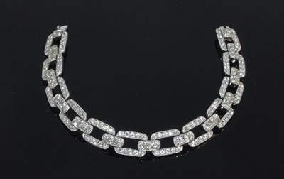 Lot 65 - A diamond set bracelet of rectangular links...