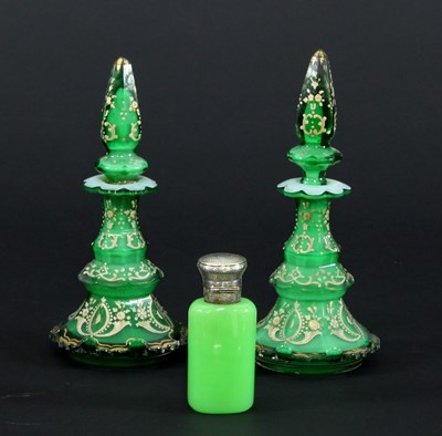 Lot 73 - A pair of late 19th Century green glass scent...