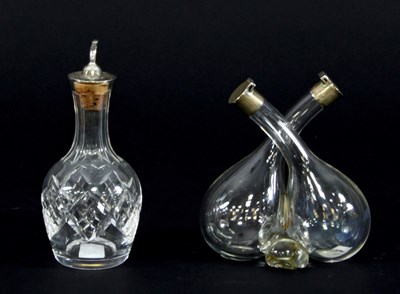 Lot 77 - An oil and vinegar twin bottle with silver...