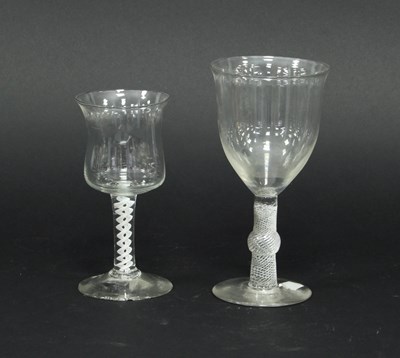 Lot 90 - A large wine glass on a knopped airtwist stem...