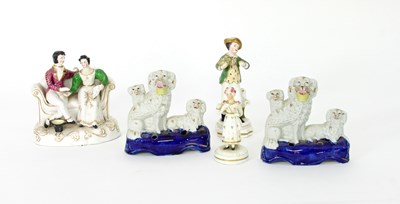 Lot 124 - Two pen stands, each with two poodles and a...