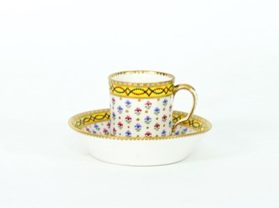 Lot 147 - A Sevres coffee can and saucer, decorated...