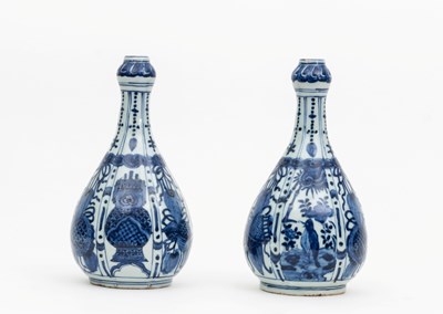 Lot 179 - A pair of Chinese blue and white bottle vases,...