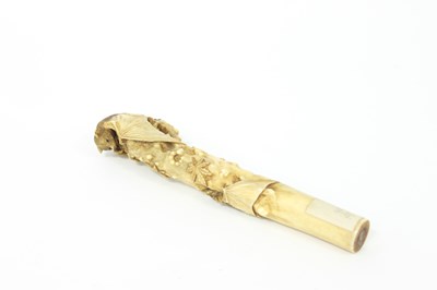 Lot 188 - A Japanese carved bone parasol handle, circa...