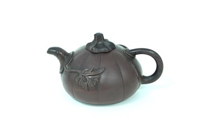 Lot 193 - A 19th Century Chinese red ware melon teapot...