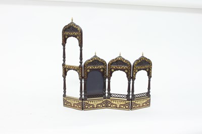 Lot 196 - A Middle Eastern carved four-part photo frame...