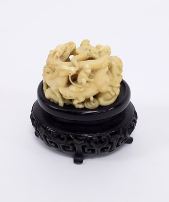 Lot 217 - A Japanese carved ivory netsuke, Meiji period,...