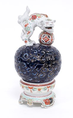 Lot 221 - A Japanese porcelain incense burner, the cover...