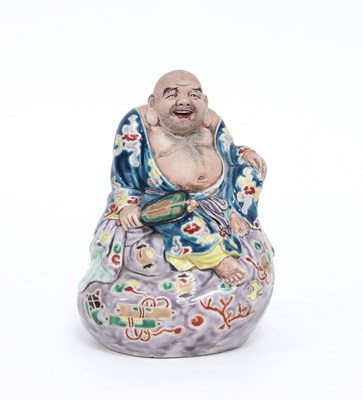 Lot 222 - A Japanese figure of Hotei, circa 1920, seated...