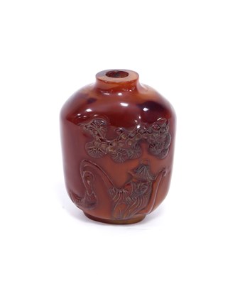 Lot 233 - A Chinese amber snuff bottle, carved with a...