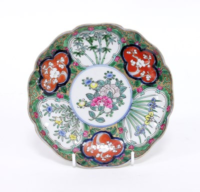 Lot 242 - A Japanese Imari dish, painted with flower...