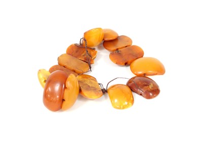 Lot 247 - A fourteen bead amber bracelet