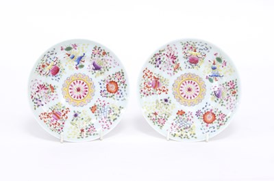 Lot 250 - A pair of Chinese famille rose saucer dishes...