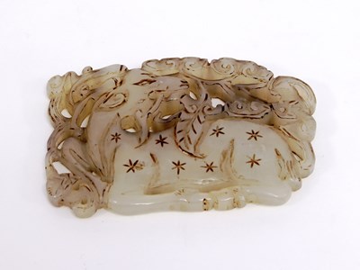 Lot 264 - A Chinese mutton fat jade pendant pierced a...