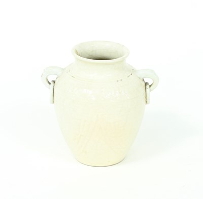 Lot 273 - A Chinese white glazed vase with ring handles,...