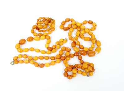 Lot 298 - A collection of five vintage amber necklaces,...