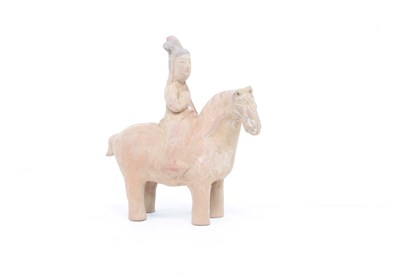 Lot 304 - A Ming dynasty pottery figure of a horse and...