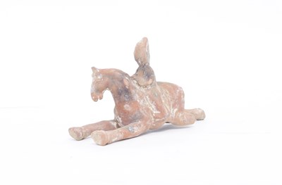 Lot 306 - A Ming Dynasty pottery equestrian figure, 18cm...