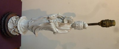 Lot 329 - A Chinese blanc-de-chine figure of Guanyin...