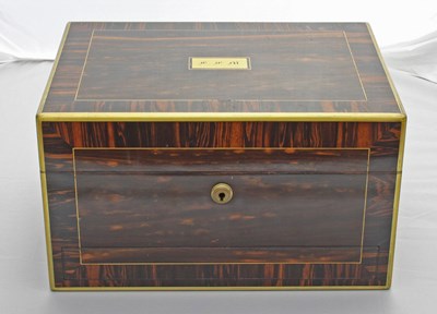 Lot 344 - An ebony dressing box, the brass rimmed lid...