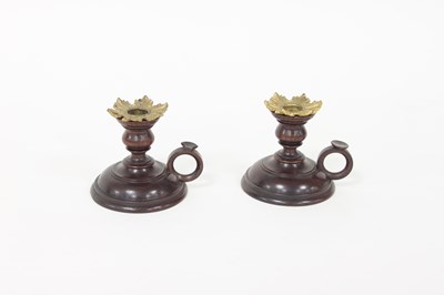 Lot 370 - A pair of turned wood chamber candlesticks...