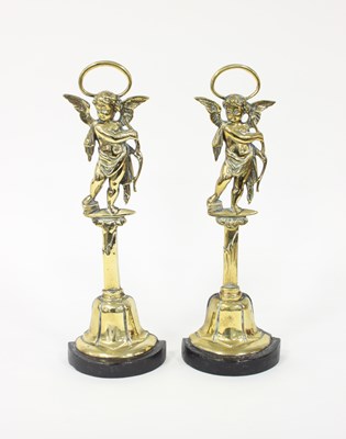 Lot 378 - A pair of brass door stops with cherub finials,...