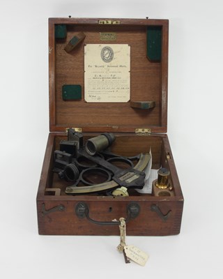 Lot 395 - A brass and ebonised sextant in a mahogany...