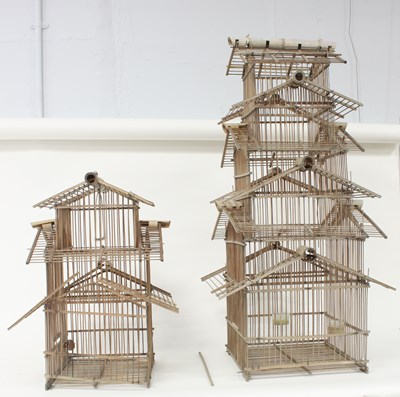 Lot 409 - Two Oriental bamboo bird cages, 92cm and 50cm...