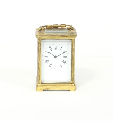 Lot 419 - A gilt brass cased carriage clock, the white...