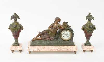 Lot 447 - A painted spelter clock set, the clock mounted...