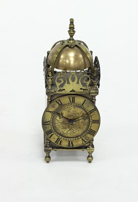 Lot 460 - A brass lantern type clock