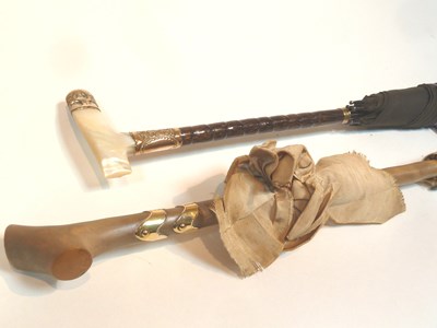 Lot 490 - A parasol with mother-of-pearl and gilt metal...