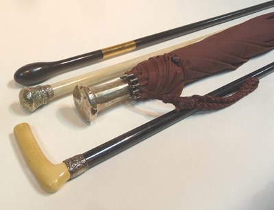 Lot 492 - A short umbrella with a silver handle, London...