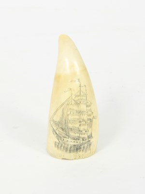 Lot 495 - A scrimshaw sperm whale tooth later carved...