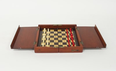 Lot 508 - An early 19th Century travelling chess set...