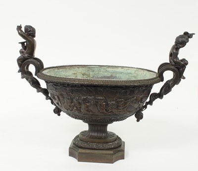 Lot 518 - A bronze two-handled vase, of oval shape with...